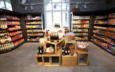 an empty grocery store filled with lots of food and drink bottles in it's aisles