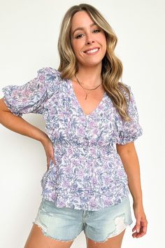 Details: Steal the show in the Sherrie Floral Pleated Smocked Waist Top! This sizzlin' top features a flowery print and comfy smocked waist, ready to turn heads wherever you go. Make 'em stop and stare - this top is a blooming good time!- Ruffle trim - Floral print - Smocked waist Content: 100% polyesterSize + Fit: Model is 5'4" and wearing a Small - Measurements from a size small - Full length: 20"- Chest: 36"- Waist: 26"-34"- Sleeves: 13" - Measurements from a size Large- Full length: 22"- Che Women Clothing Boutique, Good Time, Ruffle Trim, Boutique Clothing, Final Sale, Lilac, Full Length, Floral Print, Floral Prints