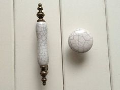 a door handle and knob on a white wooden door