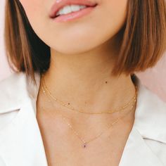 "Our dainty 14kt gold filled birthstone necklace features a tiny cubic zirconia in your choice of colored stone. These dainty birthstone necklaces are the perfect gift for a friend, sister, new mom or just for you! All items come gift boxed in our signature packaging. Ready to gift or treat yourself to a fun un-boxing moment. ♡ DETAILS: - 14kt gold filled chain and charm - won't tarnish or turn, water-proof - choose length at checkout - model wearing this 17\" layered with our satellite choker: https://etsy.me/3BxbYdA January Birthstone: Garnet February Birthstone: Amethyst March Birthstone: Aquamarine April Birthstone: Diamond May Birthstone: Emerald June Birthstone: Alexandrite July Birthstone: Ruby August Birthstone: Peridot September Birthstone: Sapphire October Birthstone: Tourmaline Birthstone Necklaces, Gold Birthstone Necklace, Personalized Gold Jewelry, Birthstone Charm Necklace, Deer Jewelry, February Birthstone Necklace, Horseshoe Necklace, Mini Gold, Pearl Necklace Earrings