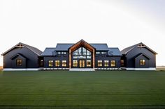 a large house that is in the middle of a field