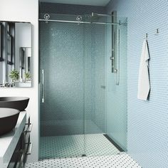 a bathroom with a sink, mirror and shower stall