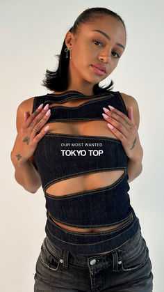 Our most requested top has arrived - the Tokyo Top is the perfect accent top for any outfit. This hand-crafted fit was meticulously designed to lift the girls while contouring your body-- creating an illusion that is guaranteed to make you stand out. The Tokyo Top is our new obsession and soon to be yours. Now available in our raw wash. Y2k Black Printed Top, Y2k Printed Streetwear Tops, Affordable Pink Streetwear Tops, Gothic Black Streetwear Tops, Black Y2k Streetwear Tops, Atl Fits, Korea Outfits, Chanel Fashion Show, Beautiful Black Hair