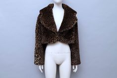 A Chantal Thomass faux fur leopard bolero jacket from her Fall-Winter 1989/1990 collection. A version of this jacket was worn on the runway by Carla Bruni. It features a double hook and eye fastening at the front. The jacket is fully lined. Will fit sizes small to large. 47% acrylic 31% modacrylic 22% polyester lining 100% acetate Made in France Measurements: shoulder to hem 42cm back length 52cm shoulders 55cm armpit to armpit 60cm sleeve 56cm This piece has been professionally cleaned and is r Fitted Faux Fur Outerwear In Leopard Print, Fitted Leopard Print Faux Fur Outerwear, Fitted Leopard Print Fur Coat For Fall, Faux Fur Bolero, Chantal Thomass, Carla Bruni, Bolero Jacket, Red Aesthetic, Faux Fur