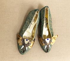 This is a pair of Italian leather shoes from Albanese Roma. They are finely crafted to resemble an elephant head. The trunk is dimensional and the details include tusks, golden ears and a blue jewel in the middle of the elephants head. The gold embossed leather portion of the shoes is very soft leather with a paisley print. The shoes are lined in gold leather and have leather soles. There is some staining on the soles of the shoes and there is a bit of discolored glue on one of the tusks. Otherw 60s Shoes, Vintage Levis Denim Jacket, Leather Jewels, Jeweled Shoes, Poodle Skirt, Italian Leather Shoes, Beaded Evening Bags, Elephant Head, An Elephant