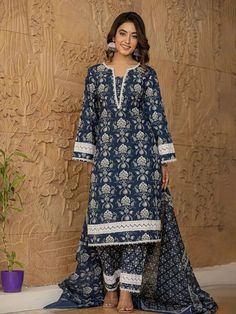 This 3-piece set includes blue cotton floral yoke print pakistani style, regular shape kurta has round neck, 3/4th sleeves, scalloped hem, calf length teamed with cotton printed trouser pants has elasticated waistband & slip on closure and a dupatta. The model wearing the size small is 5'8 in height. 3 Piece Set Color-Blue Kurta Fabric- Cotton Bottom Fabric - Cotton Dupatta Fabric-Voile Work - Floral Yoke Print detailing Neck - Round Neck Sleeves - 3/4th Sleeves Length-Calf Length Bottom - Print Plus Size Fashion For Women Indian, Dress Design Pakistani, Suits For Women Indian, Printed Kurti Designs, Cotton Suit Designs, Kurta Cotton, Pakistani Style, Latest Dress Design, Designer Kurti Patterns