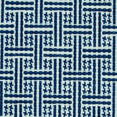 a blue and white pattern on fabric with lines in the center, as well as an abstract design