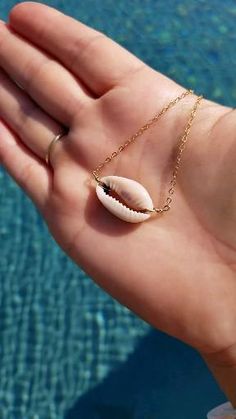 Want 20% off? Enter surfergirl during checkout. #shopsmall This is a cowrie shell necklace made in 14k gold-fill that is 16 inches. It is the perfect layering necklace for your bikini or new summer outfit. It also makes a great gift! How To Make Cowrie Shell Jewelry, Cowrie Shell Necklace Diy, How To Make Shell Necklace, She’ll Necklace, Mermaid Jewelry Diy, Shell Necklace Diy, Shell Beads Jewelry, Seashell Jewelry Diy, Beach Cupcakes