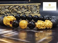 Perfect gift for yourself or your love once. Materials: Au999 Pure Gold, Lava, and Onyx Stone *Karat: 24K Pure Gold  *Gold Weight: Approximately 5.77Grams *Stone Size: Approx. 10.2mm *Gold Money Ball: 12mm  *HANDMADE ●●NOT Gold filled; NOT Gold plated. Hallmarked 🧧The tiger is a powerful symbol of strength, courage, and protection. It is also a symbol of good luck and abundance. The tiger does the job of accumulating wealth.  🧧The meteological creature Pixiu or Tianlu is believed to guard and accumulate wealth.       If your having bad luck financially or you want to guard your wealth, then Pixiu is the perfect choice for you. SH I P P I N G Free shipping in the US and International orders Handmade Gold Beaded Bracelets For Anniversary, Gold Bracelets With Round Beads As Gift, Gold Bracelets With Round Beads For Gifts, Spiritual Gold Bracelet With Round Beads As Gift, Traditional Gold Bracelets As Gifts, Gold Spiritual Bracelets As Gifts, Traditional Gold Bracelet, Money Ball, Feng Shui Bracelet