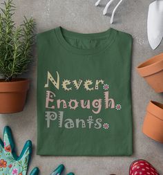 Do you like plants? Get this plant shirt, for a plant lover gift .Or wear this unisex plant lover shirt or gardening shirt while you are planting in pots or in the ground, You can never have enough plants!  Plant T Shirt, Never Enough Plants Shirt, Farmer Shirt, Planter. This classic unisex jersey short sleeve tee fits like a well-loved favorite. Soft cotton and quality print make users fall in love with it over and over again. These t-shirts have-ribbed knit collars to bolster shaping. The shou Green Plants Print T-shirt For Gardening, Green T-shirt With Plant Print For Gardening, Green Graphic Print T-shirt For Gardening, Green Tops With Plant Print For Gardening, Green Plant Print Tops For Gardening, Green Relaxed Fit T-shirt For Gardening, Casual Green T-shirt For Gardening, Green Tops With Letter Print For Gardening, Green Relaxed Fit T-shirt With Plant Detail