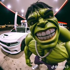 a man dressed as the incredible hulk in front of a white car