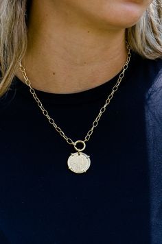 This 18k gold plated necklace features a vintage coin pendant, adding a touch of classic elegance to any outfit. Measuring 16 inches in length, it is handmade in Brazil, showcasing exceptional craftsmanship and timeless style. Perfect for layering or wearing on its own. Pairs with Liona ,Kindra and Sonya Earrings. Heirloom Brass Necklace With Coin Pendant, Gold-tone Medallion Necklace With Coin Pendant, Timeless Gold Engraved Coin Necklace, Timeless Engraved Gold Coin Necklace, Gold Timeless Medallion Necklace With Coin Pendant, Timeless Gold Medallion Necklace With Coin Pendant, Classic Gold Medallion Necklace Tarnish Resistant, Timeless Gold Medallion Coin Necklace, Classic Gold Pendant Coin Necklace