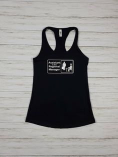 "Who else is obsessed with the office? These custom tops are perfect for your unique bachelorette party! Want \"(name) Bachelorette\" Underneath? Just add in the notes during checkout or request a custom order. Other colors available- Send me a message! THIS LISTING IS FOR TANK TOPS ONLY T-shirts available for the same price XS-XL. Please send me a custom order request -Tanks are racer-back tanks- Next Level brand- 60% combed ringspun cotton/40% polyester lightweight jersey. SUPER SOFT. These ta Fitted Graphic Print Top For Bachelorette Party, Black Crew Neck Top For Bachelorette Party, Casual Cotton Tops For Bachelorette Party, Fitted Black T-shirt For Bachelorette Party, Unique Bachelorette Party, Bachelorette Tanks, Regional Manager, Bff Shirts, Custom Top