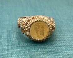 Fabulous gold ring. Maximiliano Emperador 1865 coin ring Circa 1970's. Gold is 9ct.  Current size is 7.5 (fits slightly larger due to shape). Sizing increases delivery time up to two weeks and is non returnable.  Happy to answer any questions pre purchase. Gross weght is 6.23dwt. Antique Coin-shape Engraved Signet Ring, Antique Coin Shaped Engraved Signet Ring, Antique Engraved Coin Signet Ring, Vintage Engraved Coin Signet Ring, Gold Coin-shaped Engraved Ring, Gold Coin-shaped Engraved Signet Ring, Gold Engraved Coin Signet Ring, Antique Collectible Coin Rings, Vintage 14k Gold Coin Ring