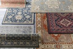 many different rugs laid out on the floor