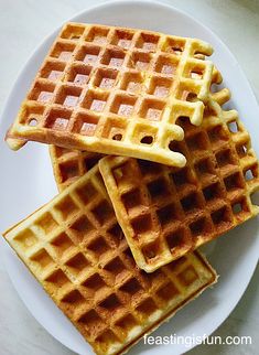 three waffles stacked on top of each other on a white plate