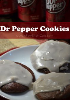 three chocolate cookies covered in white icing on a plate with the words dr pepper cookies