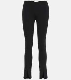 Thilde stretch-jersey leggings in black - The Row | Mytheresa Sleek High-cut Stretch Leggings, High-cut Leg Elastane Pants For Athleisure, Black Stretch Bottoms With Split Hem, Fitted Pants With Split Hem For Workwear, Chic Fitted Pants With Split Hem, Stretch Bottoms With Side Slits And Split Hem, Elegant Fitted Pants With Split Hem, Fitted High-cut Leggings For Workwear, Black Elastane Bottoms With Side Slits