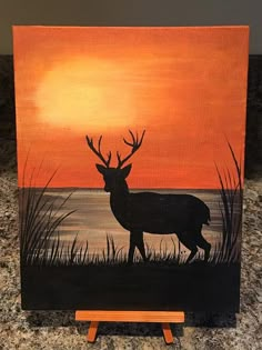 an acrylic painting of a deer at sunset