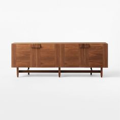 the sideboard is made out of wood and has three doors on each side, with two