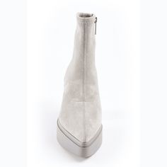 The timeless soul of '70s rock translates to this wear-anywhere ankle sock boot handcrafted in a pointy toe, strech suede and minimalist design. Details & Fit Fit is True to size Color: Gray stretch suede Detail: Pointy toe, SIde zippr for easy on, easy off. Heel measures approximately 3.5 inches//1 1/4 inch platform Shaft 6.5 inches Leather Upper and lining, Manmade sole Available in half sizes, available in sizes 5.5-11 imported Modern Fitted Ankle Platform Boots, Suede Pointed Toe Platform Boots, Suede Platform Boots With Pointed Toe, Fitted Suede Platform Boots, Modern Suede High Ankle Boots, Modern High Ankle Suede Heeled Boots, Sock Boot, Hair Care Gifts, Flat Heel Boots