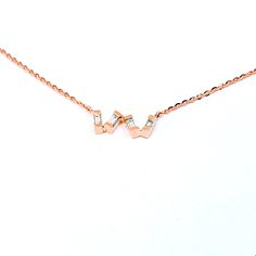 Rose gold necklace with baguette diamond. 18k rose gold. Natural diamonds. Art deco necklace. TOP QUALITY DIAMOND. 0.28 CT F COLOR. We set 4 baguette diamonds in an irregular solid gold line, in particular to create a messy effect. Delicate and Minimal necklace, perfect to be worn every day. Perfect also as wedding necklace, anniversary gift, graduation gift... Its romantic character will help make every woman special. From the menu choose the total length of the necklace, we will insert an addi Rose Gold Baguette Cut Necklace For Gift, Rose Gold Diamond Necklace With Baguette Diamonds, Rose Gold Necklaces With Baguette Diamonds, Luxury Rose Gold Diamond Necklace With Baguette Diamonds, Rose Gold Baguette Cut Fine Jewelry Necklace, Elegant Rose Gold Baguette Cut Necklace, Elegant Rose Gold Necklace With Baguette Diamonds, Fine Jewelry Baguette Diamond Necklace Gift, Formal Rose Gold Necklace With Baguette Diamonds