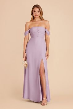 a bridesmaid in a lavender colored dress with thigh high slits and off the shoulder