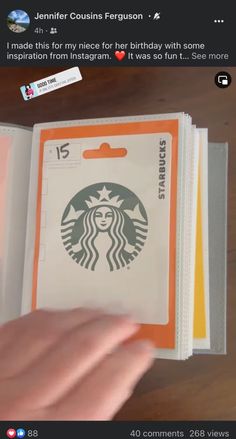 someone is holding an open book with the starbucks logo on it, and there is also a sticker that says i made this for my nice for her birthday