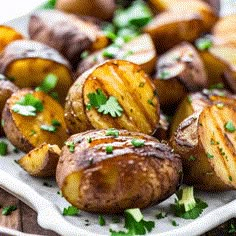 cooked potatoes on a plate with parsley