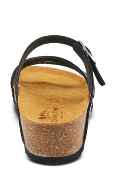 Mixed textures and asymmetric straps create visual intrigue on a slide sandal grounded by an anatomic footbed and subtle wedge heel. 1 1/4" heel Adjustable buckle strap Anatomic footbed Synthetic upper, lining and sole Made in Spain Black Cork Sandals With Leather Footbed, Black Cork Sandals With Buckle Closure, Black Wedge Heel Footbed Sandals With Removable Insole, Synthetic Wedge Heel Footbed Sandals With Buckle Closure, Synthetic Double Strap Footbed Sandals With Heel Loop, Black Wedge Heel Sandals With Cushioned Footbed, Cork Wedge Sandals With Buckle Closure, Platform Wedge, Sandal Women