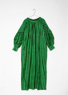 Pleated maxi dress with long sleeves in 100% handloom silk. Designed for an oversized fit. by Runaway Bicycle Green Silk Long Sleeve Midi Dress, Billowy Long Sleeve Maxi Dress For Daywear, Green Silk Long Sleeve Maxi Dress, Green Loose Fit Long Maxi Dress, Green Maxi Dress With Long Sleeves And Relaxed Fit, Green Long Maxi Dress For Daywear, Green Long Sleeve Silk Spring Dress, Oversized Maxi Dress For Daywear, Oversized Green Maxi Dress