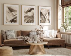 a living room filled with furniture and pictures hanging on the wall above a coffee table