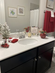 the bathroom is decorated in red and white