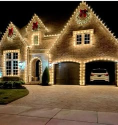 a house with christmas lights on it and a car parked in the driveway