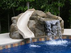 a water slide in the middle of a swimming pool