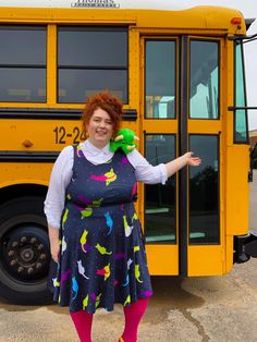 Plus size blogger dressed up as Ms. Frizzle for Halloween, complete with navy blue dress, Liz the Lizard stuffed animal on her shoulder and posing in front of a school bus! Plus Size Costume Ideas Diy, Plus Size Couple Halloween Costumes, Diy Plus Size Costumes, Easy Plus Size Halloween Costumes Diy, Plus Size Diy Halloween Costumes, Plus Size Halloween Costume Ideas Diy, Diy Plus Size Halloween Costumes, Plus Size Costume Ideas, Plus Size Halloween Costume Ideas