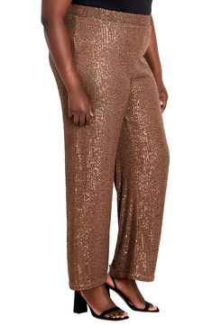 Dazzle on the dance floor all night long in these statement-making wide-leg pants decorated with twinkling sequins. 34" inseam; 14 1/2" leg opening; 14 1/2" front rise Lined 97% polyester, 3% elastane Hand wash, dry flat Imported Glamorous Embellished Pants For Festive Season, Glamorous Embellished Pants For Festive Occasions, Glamorous Embellished Festive Pants, Glamorous Festive Pants, Glamorous Fitted Wide Leg Pants With Sequins, Festive Wide Leg Embellished Pants, Embellished Bottoms For Evening Holiday Events, Festive Wide Leg Pants For Holidays, Embellished Evening Bottoms For Holidays