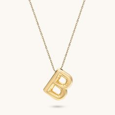 Make a statement with our Bubble Letter Necklace. This chic piece features a bold, bubble-shaped letter that reflects your unique identity. Whether worn alone or layered with other pieces, it brings a trendy yet elegant vibe, making it an ideal gift for yourself or a loved one. - Made in 14k Solid Gold - Pendant Length: 20 mm / 0.78 inches- Thickness: 6 mm / 0.24 inches -This product comes with iconic Norm Jewels gift box Bold Necklace For Gifts, Bold Necklace For Gift, Modern Personalized Necklace For Formal Occasions, Modern Initial Pendant Necklace For Formal Occasions, Modern Tan Necklace With Initial Pendant, Modern Initial Pendant Necklace With Polished Finish, Modern Tan Initial Pendant Necklace, Modern Yellow Gold Initial Necklace, Modern Polished Initial Pendant Necklace