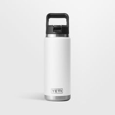 a white yeti water bottle with black lid on a white background and the word yeti written across it