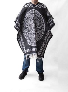 Material: Acrylic WoolColor: BlackStyle: Mexican Design: Aztek CalendarSize:Length: 192cm (75")Width: 112 cm (44")It refers to the total measurements of the poncho when it is fully open (like a blanket). Description: MEXICAN PONCHO Genuine Mexican Poncho for Men manufactured in Mexico. The Mexican Poncho is an iconic and versatile garment that has been part of Mexican culture and tradition for centuries. The colorful and artisanal designs of GAMBOA adult ponchos make them a garment that not only Black Oversized Outerwear For Festivals, Traditional Black Festival Cape, Traditional Black Cape For Festival, Casual Black Poncho For Festival, Black Long Sleeve Cotton Poncho, Traditional Black One-size Poncho, One Size Black Cape For Festival, Mens Poncho, Poncho Pullover