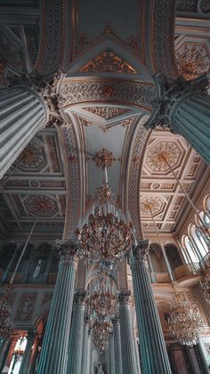 an ornate ceiling and chandelier in a building