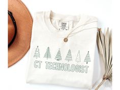 CT Tech Christmas Shirt, Comfort Colors® CT Tech Shirt, CT Technologist Christmas Tshirt, Computed Tomography Technologist, Xmas Tree About - Comfort Colors 1717 Crewneck Tshirts - 100% Ring-Spun Cotton - Relaxed Fit, Unisex Sizing - Direct to Garment (DTG) Printed - Ink is printed directly onto the item which results in a long lasting, slightly distressed look.  Care - For best care, we recommend apparel is machine washed cold (not exceeding 90 F) inside out. - Hang dry is recommended, or tumbl Labor Delivery Nursing, Occupational Therapy Shirts, Slp Shirts, Xmas Tees, Holiday Apparel, Nurse Christmas, Tech Shirt, Xmas Shirts, Dental Assistant