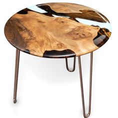 a wooden table with metal legs and a wood slab on it's top that is shaped like a tree trunk