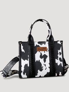 Allover cow print on canvas Whipstitch details Wrangler logo applique on the front Top zipper closure Inside of the bag includes a zippered pocket and 2 open pockets Double round handle (drop: 5.75") Detachable/adjustable cross body strap included 10.5" X 5" X 8.5" (Cross body strap 46" ) Wrangler Tote Bag, Casual Everyday Bag With Cow Print, Casual Cow Print Bags For Daily Use, Cowgirl Core, Cow Print Bag, Country Hats, Wrangler Accessories, Round Handle, Braided Hair