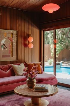 Embracing Pink in Masculine Spaces: A Bold Statement of Equality and Elegance — Living Bright Interiors Pink Mid Century Modern Living Rooms, Mid Century Pink Living Room, Disco Interior Design, Warm Tones Living Room, Peach Interior Design, Pink Midcentury Modern, Pink Interior Design, Cozy Scandinavian Living Room, Yellow Kitchen Cabinets