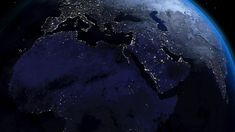 the earth is lit up at night from space