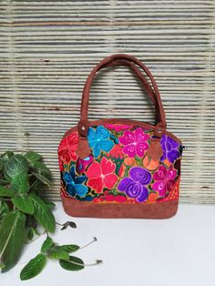 "Embroidered flower handbag, Mexican bag, made in Chiapas, Mex. About Our Items: Each of our pieces are carefully crafted by artisans from the states of Oaxaca and Chiapas. Our items are made of cotton. We ship anywhere in the word, from Tepic, Nayarit, mx. Care Instructions: Please take care to handwash your items in cold water and hang to dry. Measurement in inches 15\" inches wide. 11.5\" height." Handmade Multicolor Embroidered Hobo Bag For Everyday Use, Multicolor Floral Embroidered Tote Shoulder Bag, Handmade Multicolor Embroidery Hobo Bag For Everyday Use, Multicolor Floral Embroidery Tote Shoulder Bag, Handmade Multicolor Embroidery Hobo Bag, Festival Shoulder Bag With Multicolor Floral Embroidery, Multicolor Floral Embroidered Shoulder Bag For Festivals, Floral Embroidered Shoulder Bag For Festivals, Festival Shoulder Bag With Floral Embroidery