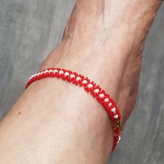 Ankle or wrist bracelet according to your tastes woven with a special water-resistant nylon jewelry thread for going to the beach. It was woven and hand made by myself. It is composed of round MIYUKI glass beads 11/0 red and 8/0 white. Its lobster clasp and golden ring are made of lead- and nickel-free stainless steel and do not cause allergies. I made this bracelet in 4 lengths: 22cm - 23cm - 24cm - 25cm Its width is 5 MM or 0.6 cm. This ankle bracelet will be sublime on your legs this summer, Red Adjustable Friendship Bracelets With Tiny Beads, Adjustable Red Friendship Bracelets With Tiny Beads, Handmade Nylon Thread Bracelets For Friendship, Handmade Flexible Friendship Bracelets As Gift, Handmade Red Casual Friendship Bracelets, Handmade Friendship Bracelets As Gift, White Nylon Cord Bracelets For Beach, Casual Red Handmade Friendship Bracelets, Traditional Red Friendship Bracelets For Beach