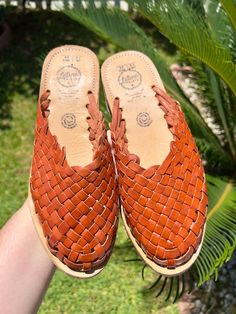 COLOR: BRICKUPPER: LEATHERSOLE: CREPE Handmade huaraches from Michoacán, Mexico. Made with 100% leather. SIZING *Please refer to sizing chart*If you wear a half-size shoe we recommend sizing down (ex: Your shoe size is 7.5, size down to size 7)If you have a wide foot, For example, your shoe size is 7.5 then size up for a more comfortable fit. Leather stretches and will mold after a few uses*Please advise since all of our huaraches are handmade with genuine leather minor wrinkles and markings mig Casual Adjustable Closed Toe Mules, Casual Woven Leather Slip-on Huarache Sandals, Spring Brown Woven Leather Huaraches, Casual Natural Huaraches With Stitched Sole, Adjustable Leather Mules With Round Toe, Casual Adjustable Brown Mules, Casual Brown Huarache Sandals Fair Trade, Flat Woven Leather Huarache Sandals, Casual Huarache Slip-on Sandals With Leather Footbed