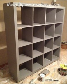 the before and after ikea bookcase is being painted in gray with white trim